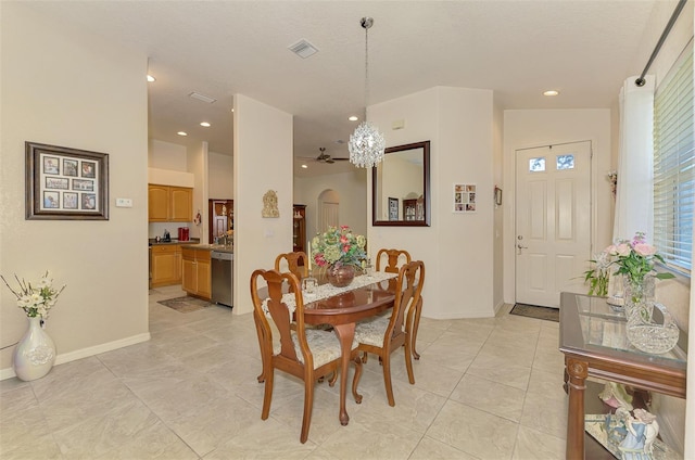 dining area featuring visible vents, arched walkways, baseboards, and recessed lighting