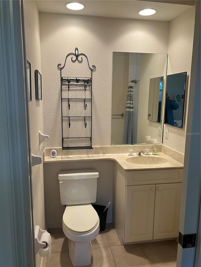 full bath featuring vanity, tile patterned flooring, toilet, and recessed lighting