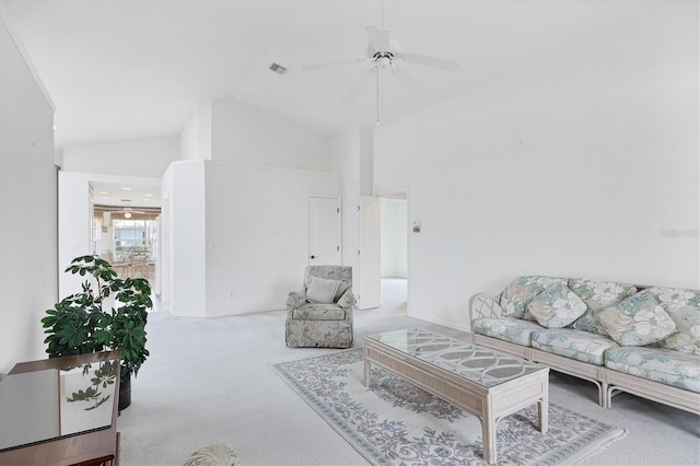 carpeted living area with high vaulted ceiling, visible vents, and ceiling fan