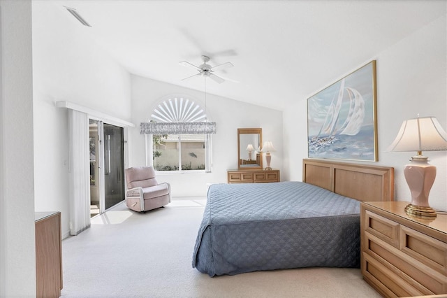 carpeted bedroom with access to exterior, ceiling fan, visible vents, and vaulted ceiling