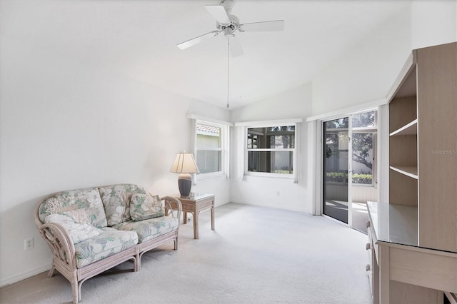 sitting room featuring a ceiling fan, carpet flooring, and vaulted ceiling