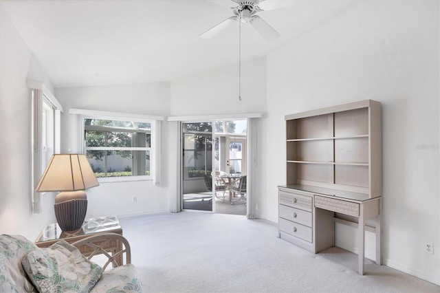 living area with high vaulted ceiling, carpet, ceiling fan, and baseboards