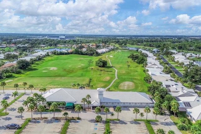 bird's eye view featuring view of golf course, a water view, and a residential view