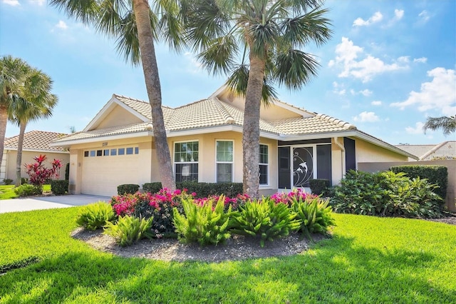 view of front of house with stucco siding, concrete driveway, an attached garage, a tiled roof, and a front lawn