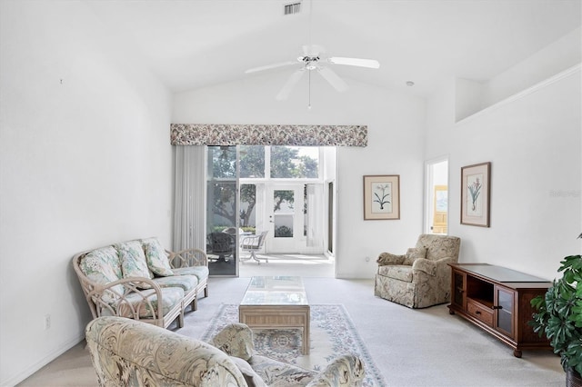 living area featuring visible vents, carpet floors, high vaulted ceiling, and a ceiling fan