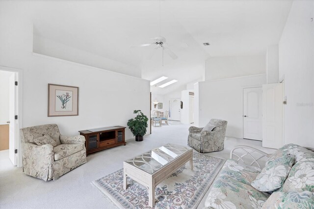 carpeted living area with vaulted ceiling and a ceiling fan