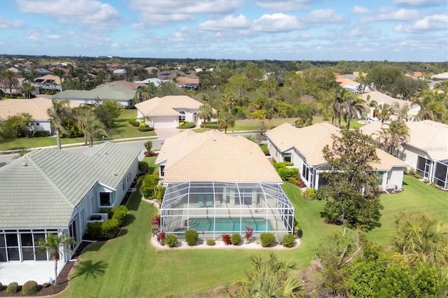 birds eye view of property with a residential view