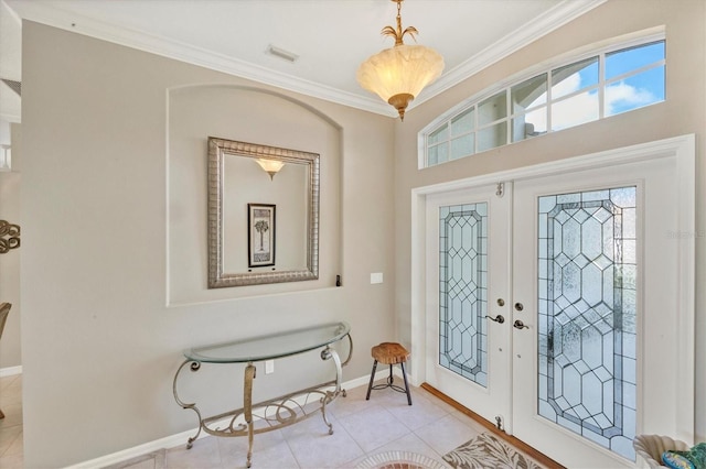 entryway featuring french doors, crown molding, visible vents, light tile patterned flooring, and baseboards