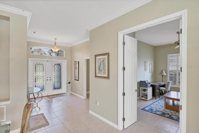 foyer entrance with french doors, light tile patterned floors, visible vents, ornamental molding, and baseboards