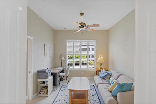 living room featuring ceiling fan, light tile patterned flooring, and baseboards