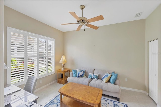 living area featuring visible vents, baseboards, and light tile patterned flooring