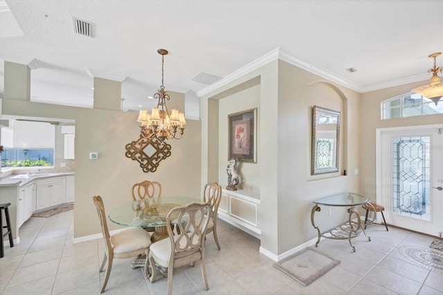 dining area featuring a notable chandelier, visible vents, ornamental molding, light tile patterned flooring, and baseboards