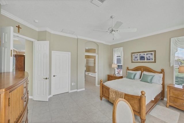 bedroom featuring light tile patterned floors, ornamental molding, visible vents, and ensuite bathroom