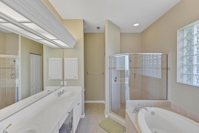 full bathroom featuring a garden tub, mail area, a stall shower, a sink, and tile patterned flooring