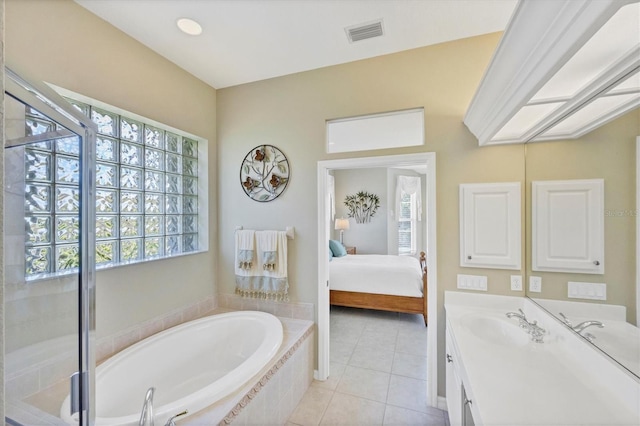 bathroom featuring a healthy amount of sunlight, ensuite bath, visible vents, and vanity