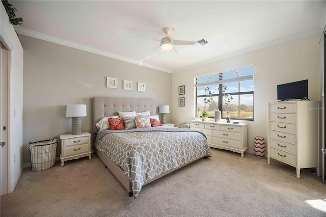 bedroom featuring light carpet, ceiling fan, visible vents, and crown molding