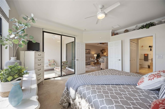 bedroom with ornamental molding, carpet, a closet, and ensuite bath