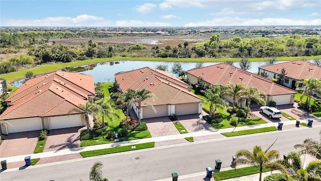 birds eye view of property with a water view