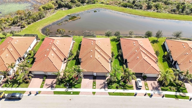 aerial view featuring a water view and a residential view