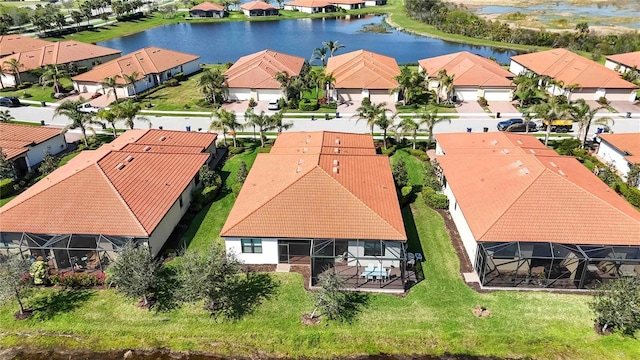 aerial view with a water view and a residential view