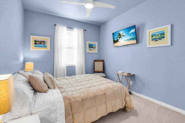 bedroom with carpet flooring, a ceiling fan, and baseboards