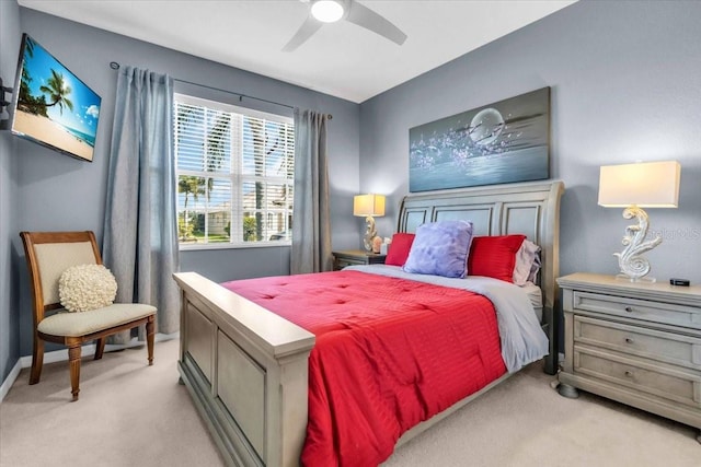 bedroom featuring a ceiling fan and light carpet