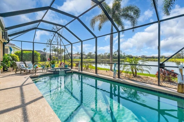 view of pool featuring glass enclosure, a patio area, and a water view