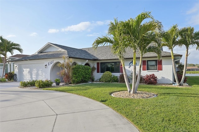 single story home with a garage, concrete driveway, a front lawn, and stucco siding