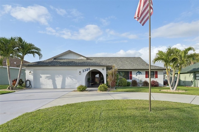 ranch-style house with driveway, a garage, a front lawn, and stucco siding