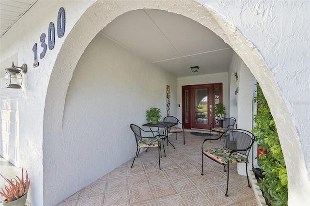 view of exterior entry with stucco siding