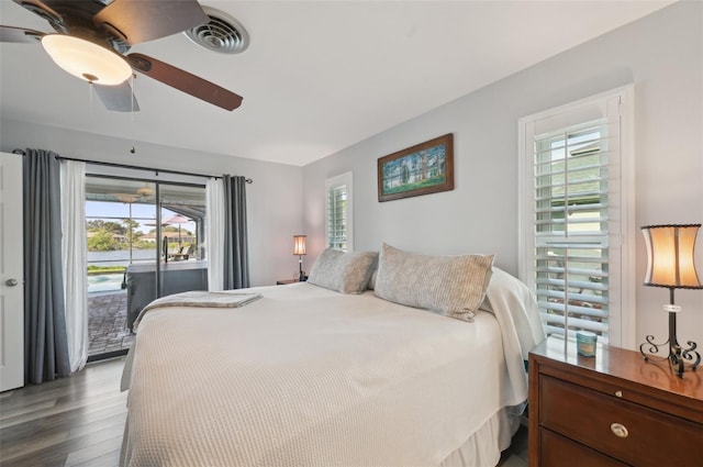 bedroom featuring access to exterior, ceiling fan, visible vents, and wood finished floors