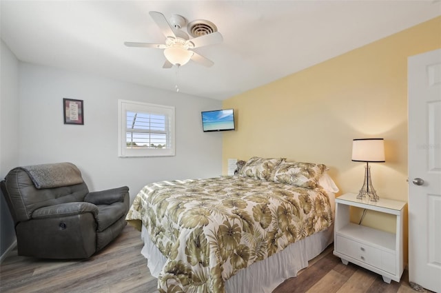 bedroom with wood finished floors and a ceiling fan