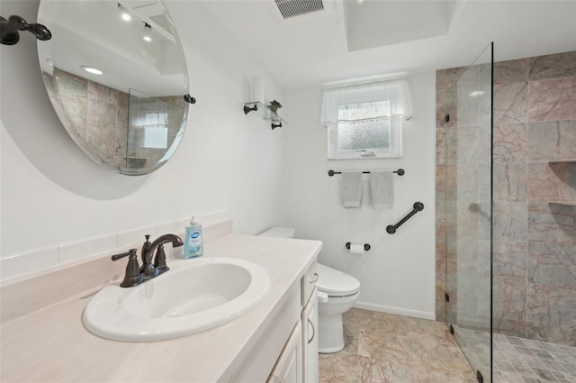 full bathroom featuring baseboards, visible vents, toilet, vanity, and a walk in shower