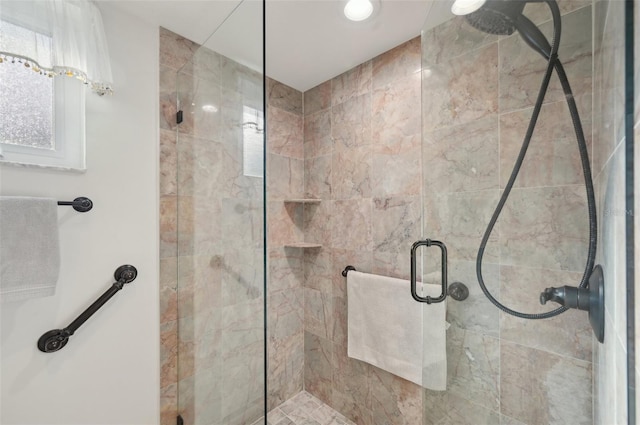 bathroom with a shower stall