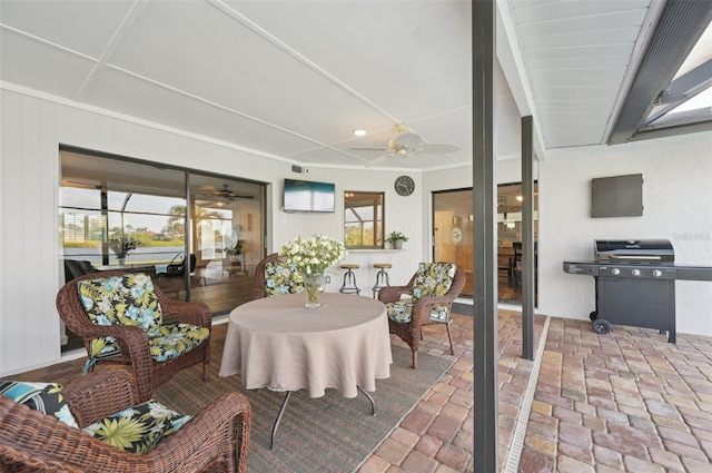 dining room with brick floor and ceiling fan