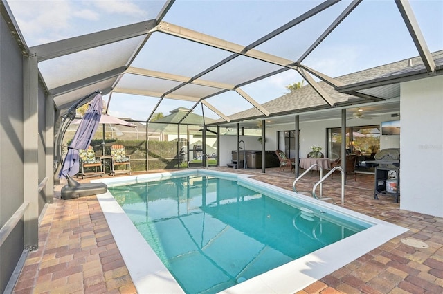 pool with a patio area and a lanai