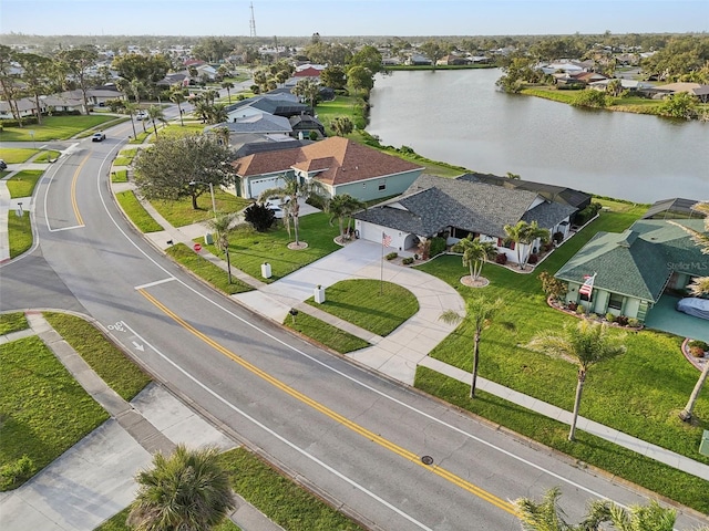 bird's eye view with a residential view and a water view