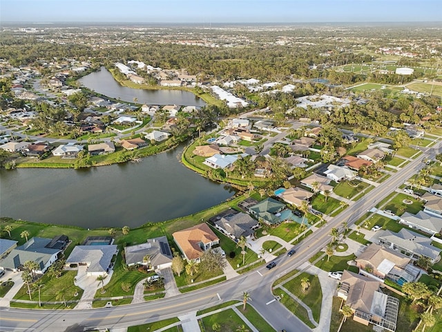 birds eye view of property featuring a water view and a residential view