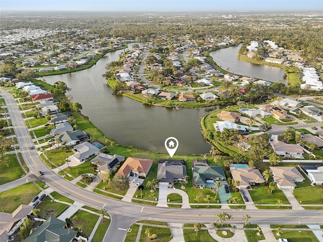 aerial view featuring a water view and a residential view