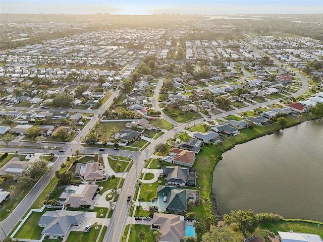 bird's eye view featuring a water view and a residential view