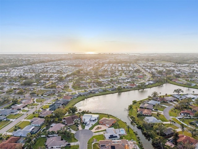 bird's eye view with a water view and a residential view