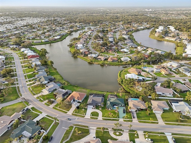 aerial view featuring a water view and a residential view