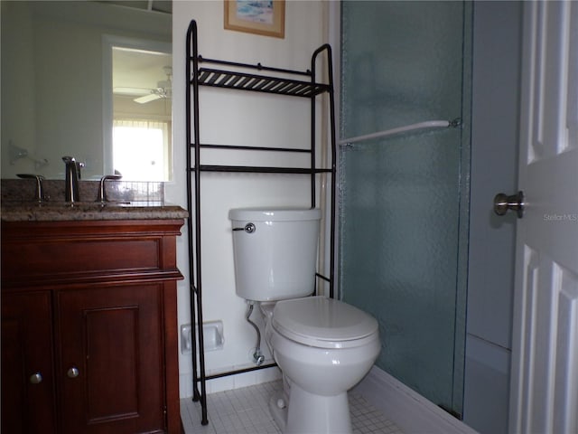 bathroom featuring vanity, toilet, and tile patterned floors