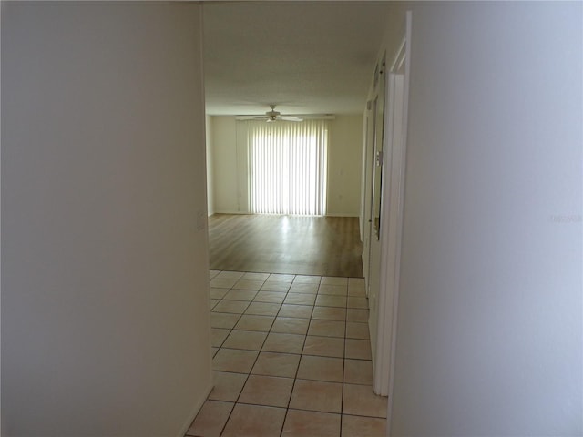 corridor with light tile patterned floors