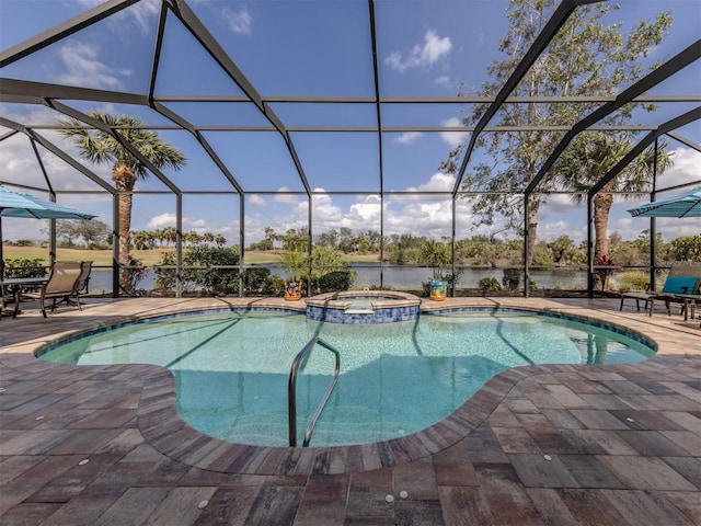 view of swimming pool with a patio area, a lanai, a pool with connected hot tub, and a water view