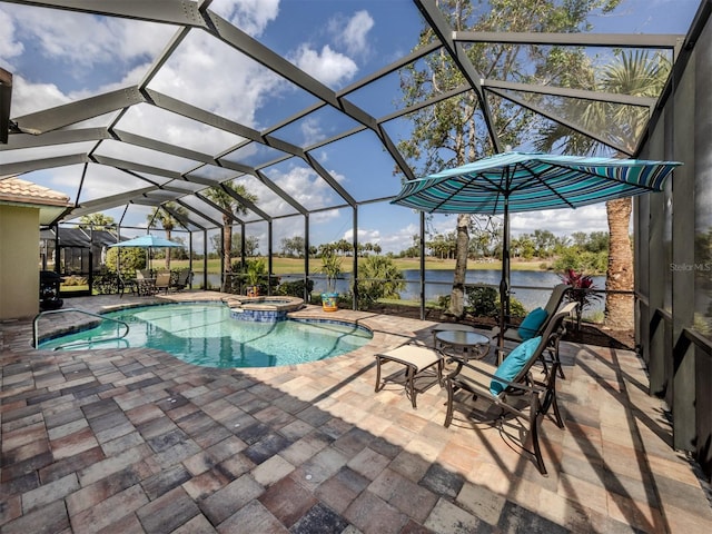 view of swimming pool with a pool with connected hot tub, a patio area, a water view, and a lanai