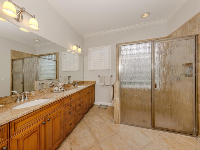 bathroom featuring crown molding and a sink