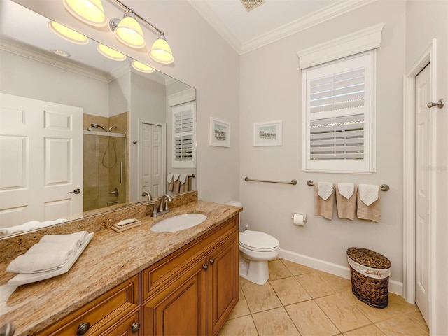 full bathroom with ornamental molding, a stall shower, vanity, baseboards, and tile patterned floors