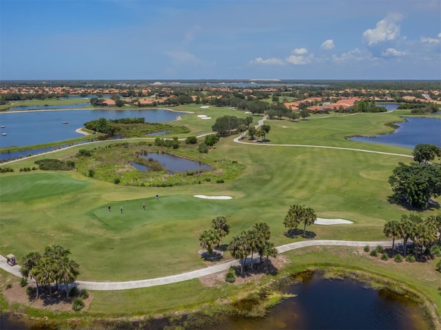 aerial view featuring view of golf course and a water view