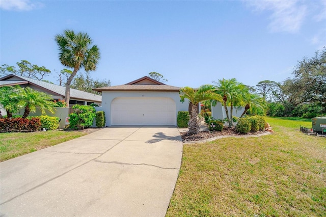 view of front of property with an attached garage, a front lawn, concrete driveway, and stucco siding